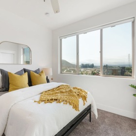 Bedroom with natural lighting and high ceilings