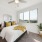 Bedroom with natural lighting and high ceilings
